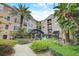Scenic view of the building's courtyard featuring a water fountain and lush vegetation with a pathway at 4221 W Spruce St # 2328, Tampa, FL 33607