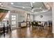 A dining area features a long wooden table with black chairs and modern decor throughout the room at 4221 W Spruce St # 2328, Tampa, FL 33607