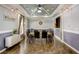 A dining area features a long wooden table with black chairs and modern decor throughout the room at 4221 W Spruce St # 2328, Tampa, FL 33607