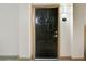 A dark wood door with a silver handle with a light and the unit number on the wall at 4221 W Spruce St # 2328, Tampa, FL 33607