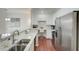Kitchen featuring stainless steel appliances, barstool seating, and granite countertops at 4221 W Spruce St # 2328, Tampa, FL 33607