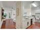 Open-concept kitchen featuring modern cabinets, stainless appliances, and breakfast bar at 4221 W Spruce St # 2328, Tampa, FL 33607
