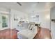 Comfortable living room featuring a large sectional sofa and hardwood flooring at 4221 W Spruce St # 2328, Tampa, FL 33607