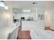 Open-concept living space with a view of the kitchen, dining area, and hardwood floors at 4221 W Spruce St # 2328, Tampa, FL 33607