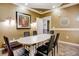 Meeting room featuring a long white table, black chairs, and decorative elements for a professional atmosphere at 4221 W Spruce St # 2328, Tampa, FL 33607