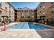 A clear blue pool is surrounded by lounge chairs and lush landscaping in a courtyard setting at 4221 W Spruce St # 2328, Tampa, FL 33607