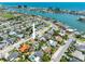 Coastal home with lush landscaping, a pool, and easy access to the beach and waterfront, shown from above at 429 87Th Ave, St Pete Beach, FL 33706