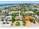 An aerial view highlights this home's desirable neighborhood and proximity to the ocean and surrounding city at 429 87Th Ave, St Pete Beach, FL 33706