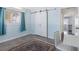 Bedroom features a sliding closet door, bright walls, and a large window with curtains at 429 87Th Ave, St Pete Beach, FL 33706