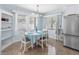 Cozy dining area featuring built-in shelving, modern lighting, and a practical layout for casual meals and entertaining at 429 87Th Ave, St Pete Beach, FL 33706