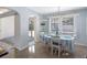 Bright dining room with built-in shelving and view of the pool, perfect for casual meals and gatherings at 429 87Th Ave, St Pete Beach, FL 33706