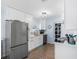 Bright kitchen features white cabinetry, stainless steel appliances, and a window above the sink at 429 87Th Ave, St Pete Beach, FL 33706