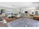 Spacious living area featuring a large sectional, stylish rugs, and an open layout perfect for entertaining at 429 87Th Ave, St Pete Beach, FL 33706