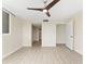 Bright room with updated flooring, ceiling fan, and closet organizer offer an inviting space at 450 Treasure Isle Causeway # 212, Treasure Island, FL 33706