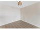 A simple room with white walls, light colored floors and a modern ceiling light at 450 Treasure Isle Causeway # 212, Treasure Island, FL 33706