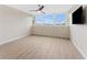 Bedroom featuring sleek flooring, a modern ceiling fan, and large windows for natural light and views at 450 Treasure Isle Causeway # 212, Treasure Island, FL 33706