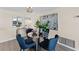 Cozy dining area with a glass table, comfortable chairs, and stylish decor, perfect for intimate meals at 450 Treasure Isle Causeway # 212, Treasure Island, FL 33706