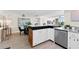 Spacious kitchen with an island opens to the dining and living areas, perfect for entertaining guests at 450 Treasure Isle Causeway # 212, Treasure Island, FL 33706
