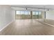 Spacious, light-filled room with neutral walls, light-colored flooring, and an abundance of natural light at 450 Treasure Isle Causeway # 212, Treasure Island, FL 33706