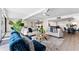 Open floorplan featuring living room with mirrored wall and view to dining area and kitchen at 450 Treasure Isle Causeway # 212, Treasure Island, FL 33706