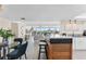 Open living space is stylishly furnished and filled with natural light, adjacent to kitchen at 450 Treasure Isle Causeway # 212, Treasure Island, FL 33706