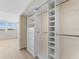 Walk-in closet with custom built-in shelving and drawers at 450 Treasure Isle Causeway # 212, Treasure Island, FL 33706