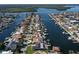 Aerial view of community showing wide canals and various waterfront properties at 5133 Glenn Dr, New Port Richey, FL 34652