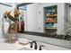 Stylish bathroom featuring a vanity with countertop, and framed mirror, complemented by coastal accents at 5133 Glenn Dr, New Port Richey, FL 34652