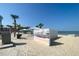 Picturesque beach vista with picnic spots and an artistic mural wall, offering a serene coastal experience at 5133 Glenn Dr, New Port Richey, FL 34652