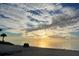 A breathtaking sunset over a tranquil beach, creating a serene and picturesque scene at 5133 Glenn Dr, New Port Richey, FL 34652