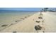 Expansive beach view showcasing a pristine shoreline and tranquil waters at 5133 Glenn Dr, New Port Richey, FL 34652
