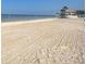 Expansive beach with gentle waves, soft sand, and a serene ocean view at 5133 Glenn Dr, New Port Richey, FL 34652