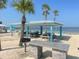 Charming beach picnic area with shaded tables and a barbecue grill for outdoor gatherings at 5133 Glenn Dr, New Port Richey, FL 34652