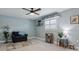 Cozy bedroom with a ceiling fan, comfortable seating, and a charming decor creating a relaxing space at 5133 Glenn Dr, New Port Richey, FL 34652