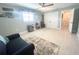 Spacious bedroom featuring a large closet, a ceiling fan, and neutral tones with calming decor at 5133 Glenn Dr, New Port Richey, FL 34652