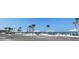 Beachfront community with parking, shelters, and palm trees for a relaxed seaside lifestyle at 5133 Glenn Dr, New Port Richey, FL 34652