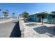 Beachside Community featuring a parking lot, picnic shelters, a restroom, and a beautiful sandy beach at 5133 Glenn Dr, New Port Richey, FL 34652