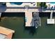 Aerial view of a private boat dock with boat lift and space for lounging at 5133 Glenn Dr, New Port Richey, FL 34652