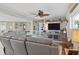 Relaxing living room with coastal decor, a gray sofa, and cozy textures at 5133 Glenn Dr, New Port Richey, FL 34652