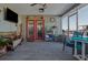 Enclosed patio with cozy seating, views, and coastal decor perfect for relaxation and entertaining at 5133 Glenn Dr, New Port Richey, FL 34652