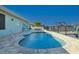 Private backyard with pool, a fire pit and boat lift on the water perfect for entertaining at 5133 Glenn Dr, New Port Richey, FL 34652