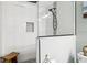 The stand up shower features mosaic accents and seamless glass doors at 5133 Glenn Dr, New Port Richey, FL 34652