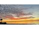Beautiful sunset view on the beach with colorful, dramatic clouds over calm water at 5133 Glenn Dr, New Port Richey, FL 34652