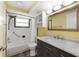 Bright bathroom with tub and updated vanity at 5720 Mockingbird Dr, New Port Richey, FL 34652
