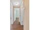 Inviting hallway features neutral walls and hard surface flooring at 5720 Mockingbird Dr, New Port Richey, FL 34652