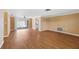 Open-concept living space features neutral walls and smooth floors, leading to a sunroom at 5720 Mockingbird Dr, New Port Richey, FL 34652