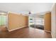 Bright living area with smooth floors and sliders to lanai with ceiling fan at 5720 Mockingbird Dr, New Port Richey, FL 34652