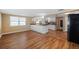 Bright and airy living area leading to kitchen, featuring tile flooring at 5720 Mockingbird Dr, New Port Richey, FL 34652