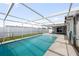 Backyard pool with open frame, surrounded by privacy fence at 5720 Mockingbird Dr, New Port Richey, FL 34652