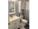Neat bathroom featuring a vanity, toilet, and shower with a stylish curtain at 6446 71St N St, Pinellas Park, FL 33781